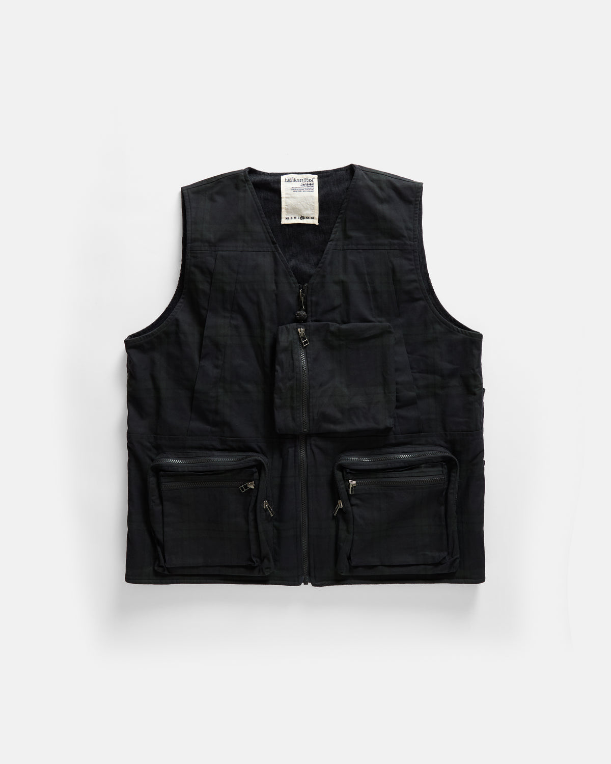 KEARSE REVERSIBLE UTILITY VEST - BARELY BLACKWATCH BEESWAX COATED COTTON TWILL AND BLACK COTTON CORDUROY