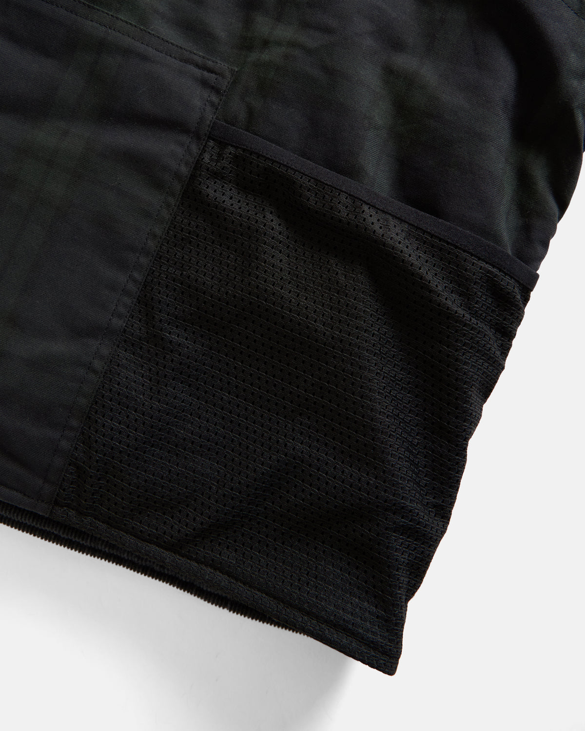 KEARSE REVERSIBLE UTILITY VEST - BARELY BLACKWATCH BEESWAX COATED COTTON TWILL AND BLACK COTTON CORDUROY