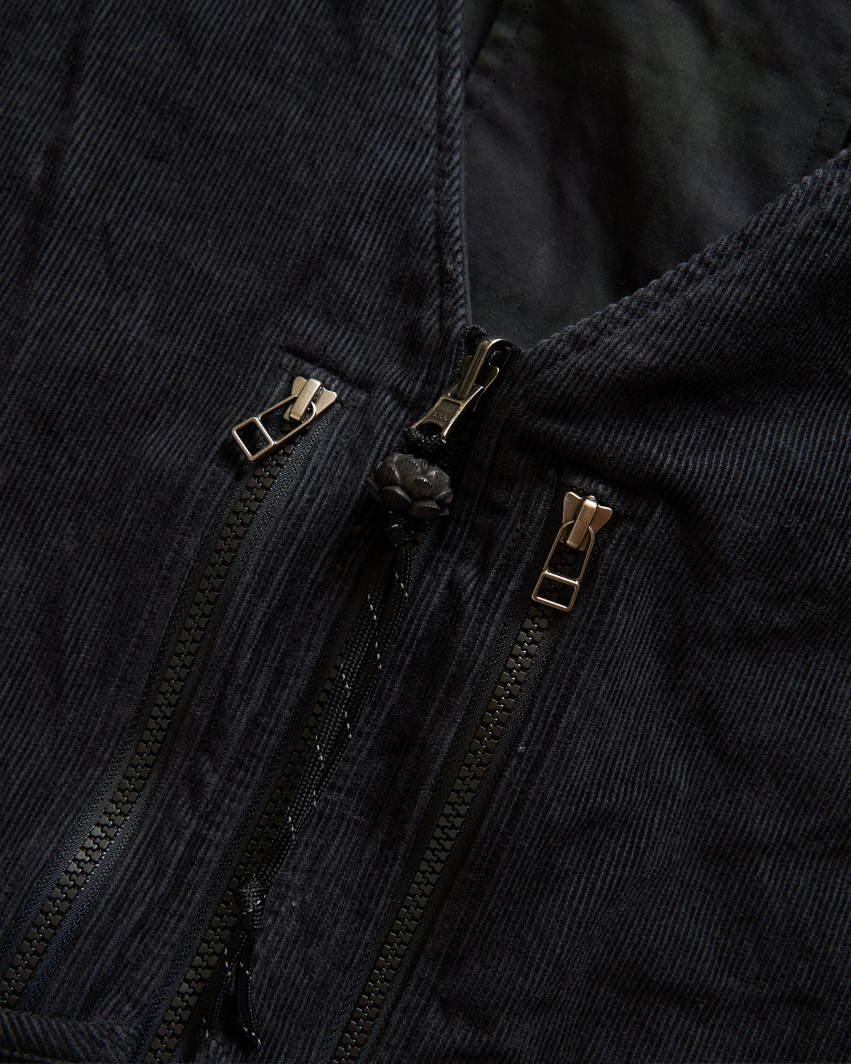 KEARSE REVERSIBLE UTILITY VEST - BARELY BLACKWATCH BEESWAX COATED COTTON TWILL AND BLACK COTTON CORDUROY