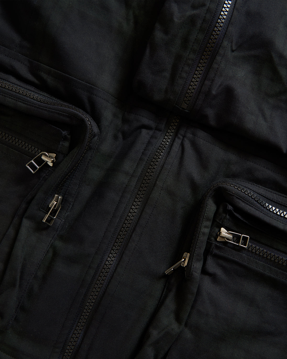 KEARSE REVERSIBLE UTILITY VEST - BARELY BLACKWATCH BEESWAX COATED COTTON TWILL AND BLACK COTTON CORDUROY