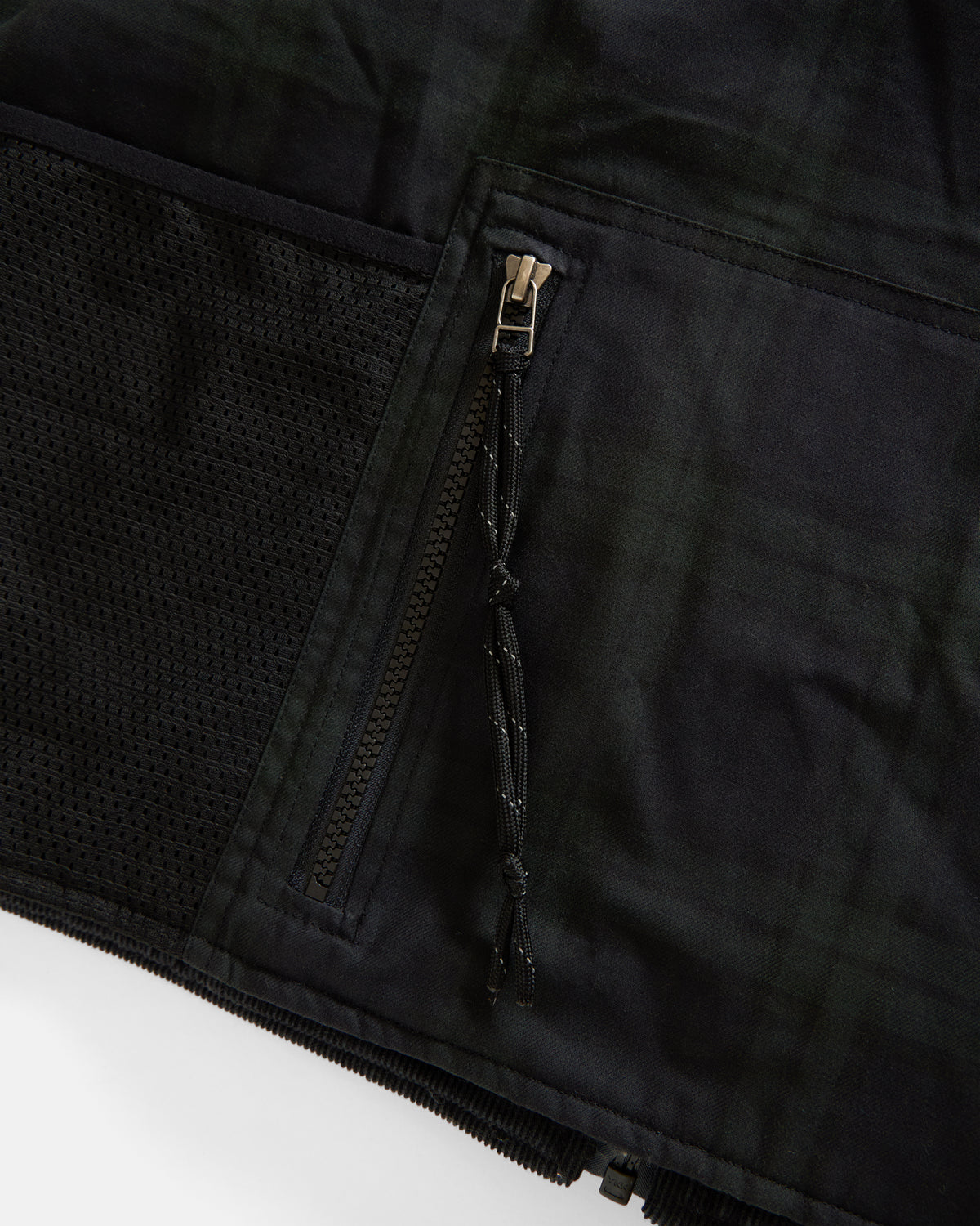 KEARSE REVERSIBLE UTILITY VEST - BARELY BLACKWATCH BEESWAX COATED COTTON TWILL AND BLACK COTTON CORDUROY