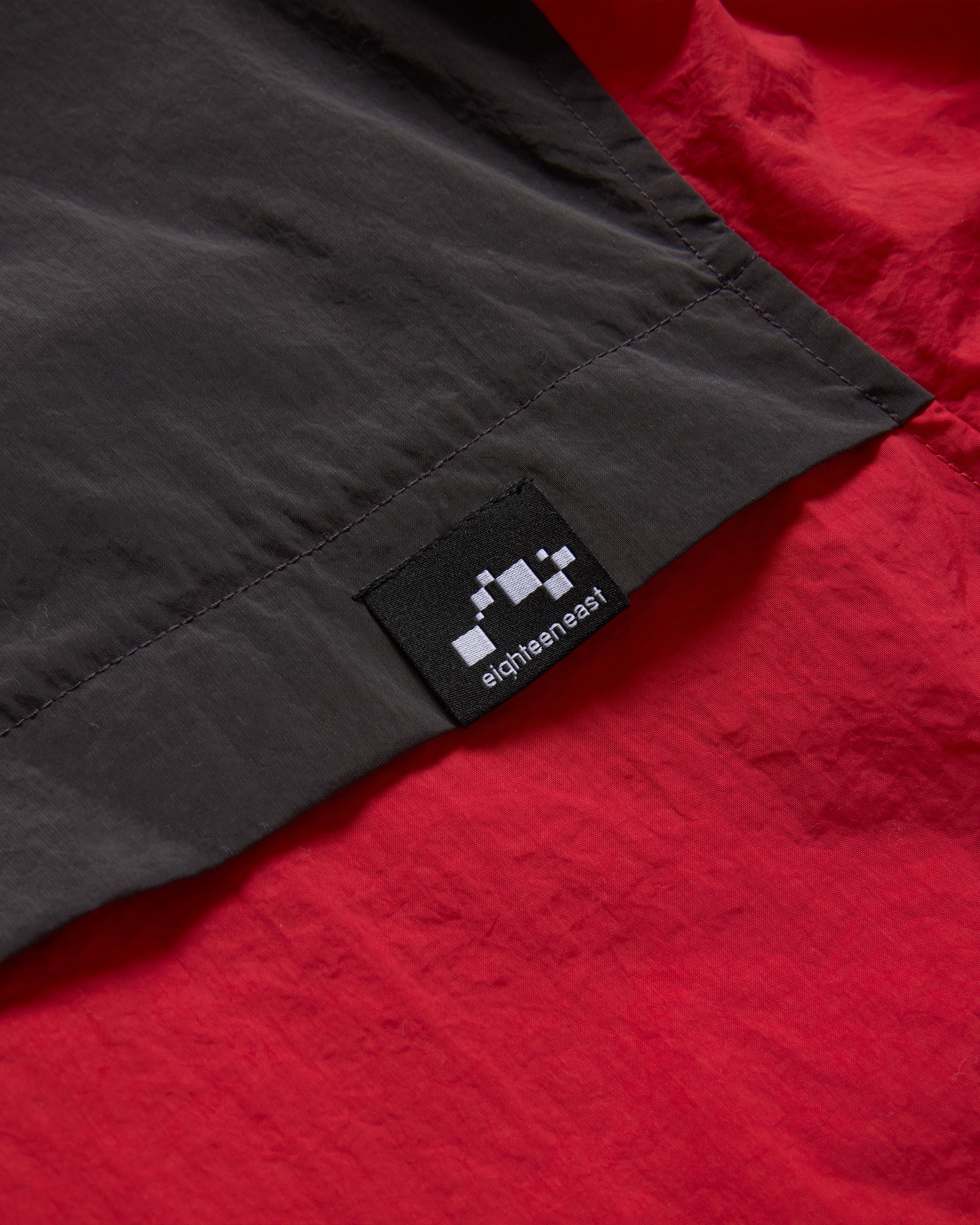 LAINES HOODED SHELL - DAN & WHIT'S RED / WASHED BLACK WATER-REPELLENT NYLON