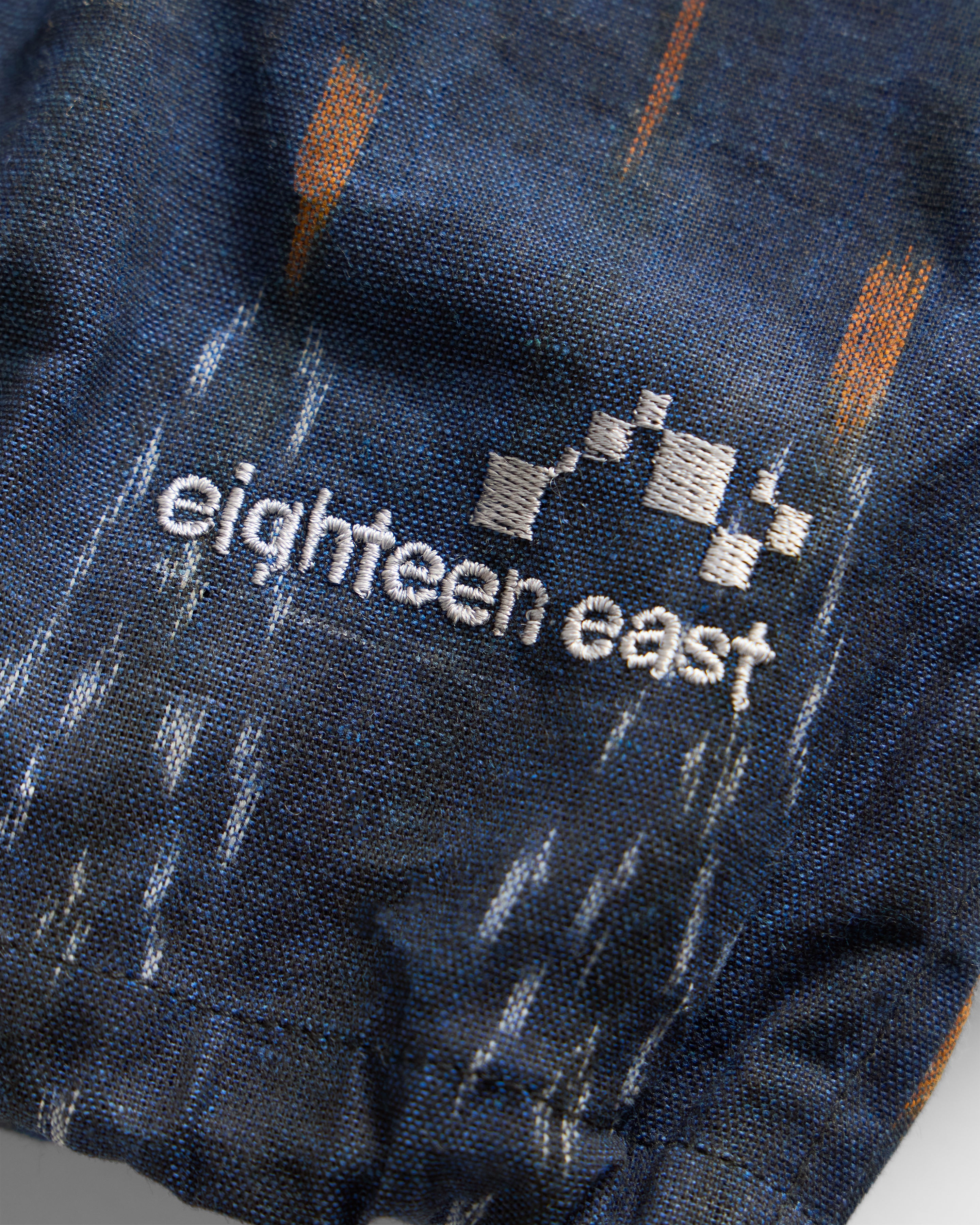 BANKS 2.0 UTILITY JACKET - MIDNIGHT / ECRU / ORANGE BEESWAX COATED HANDWOVEN COTTON IKAT