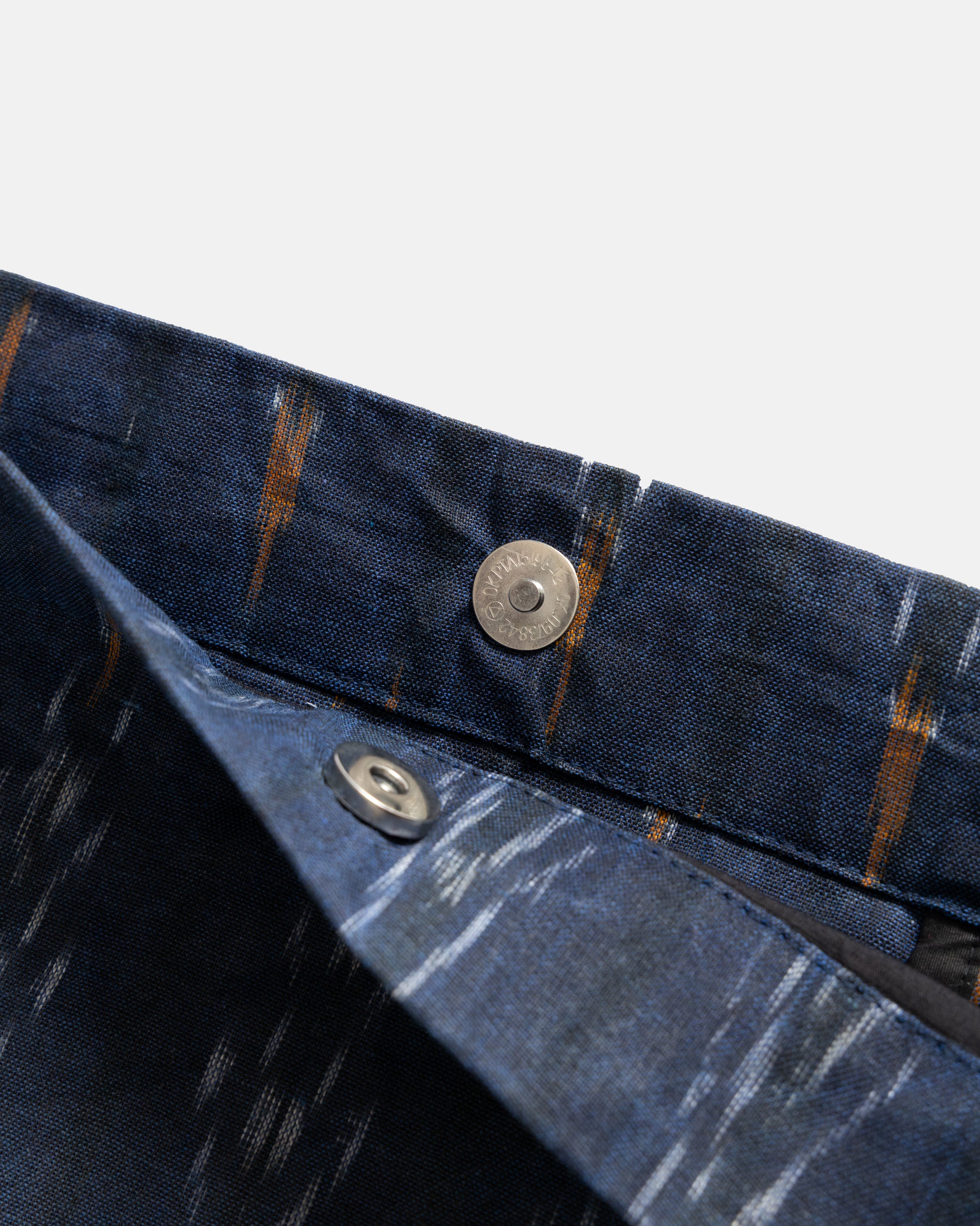 CONVERTIBLE CARRY-ALL SLING - MIDNIGHT / ECRU / ORANGE BEESWAX COATED HANDWOVEN COTTON IKAT