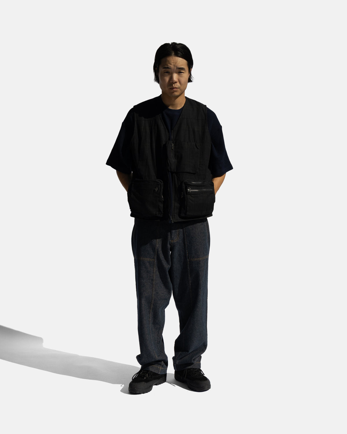 KEARSE REVERSIBLE UTILITY VEST - BARELY BLACKWATCH BEESWAX COATED COTTON TWILL AND BLACK COTTON CORDUROY