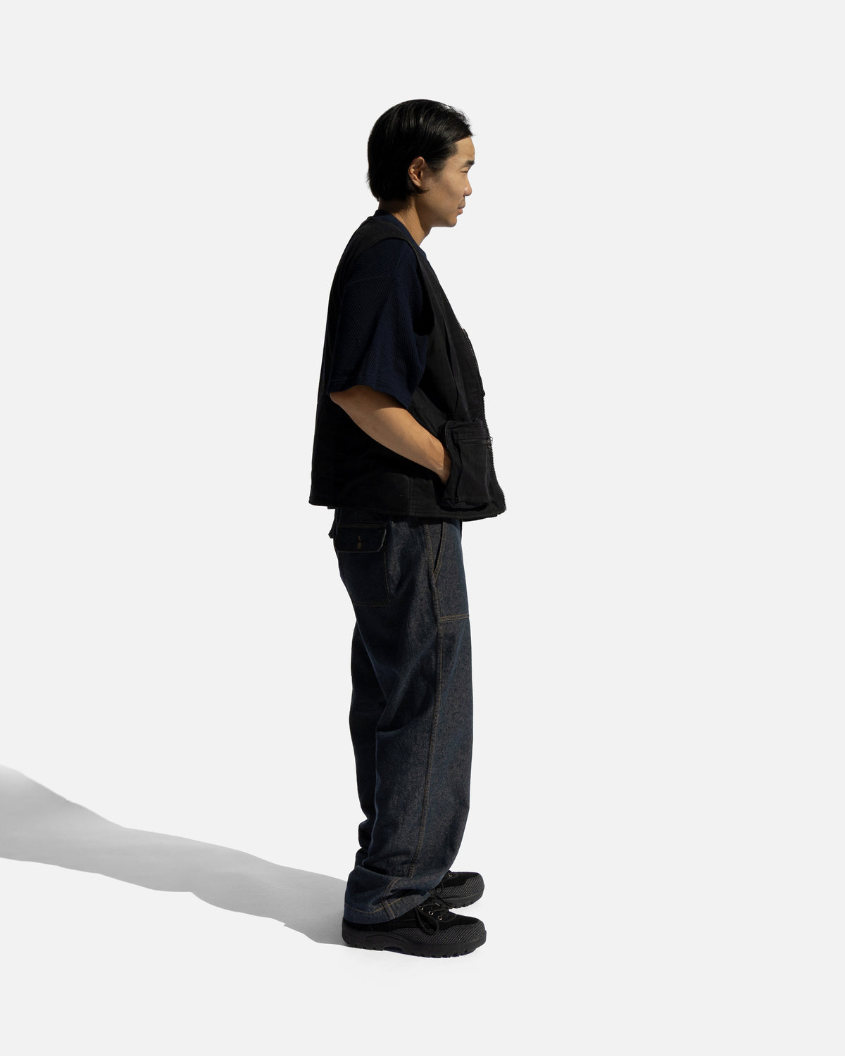 KEARSE REVERSIBLE UTILITY VEST - BARELY BLACKWATCH BEESWAX COATED COTTON TWILL AND BLACK COTTON CORDUROY